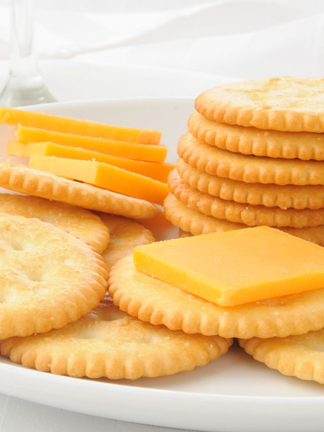 slice of cheddar cheese on crackers on plate what to serve with ravioli