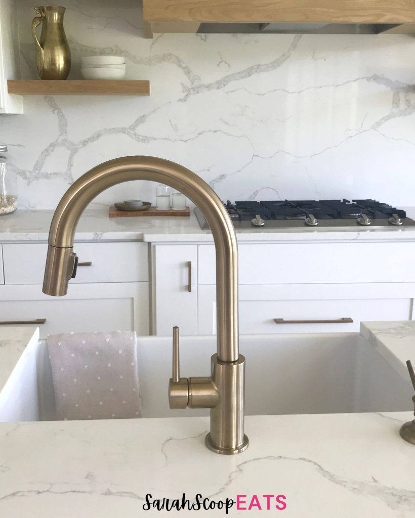 gold kitchen faucet for a farmhouse sink