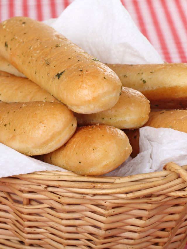 breadsticks in a woven basket