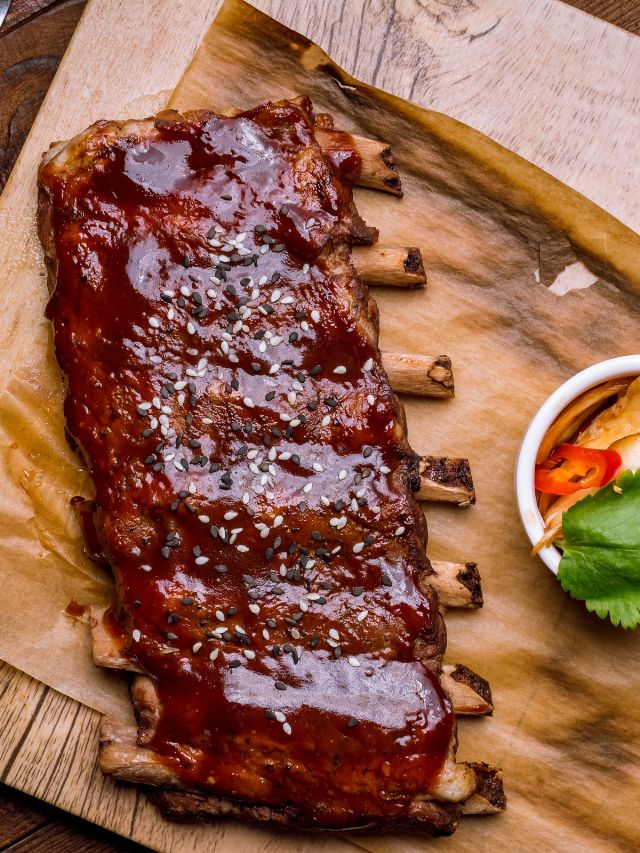 a rack of ribs with sauce on it
