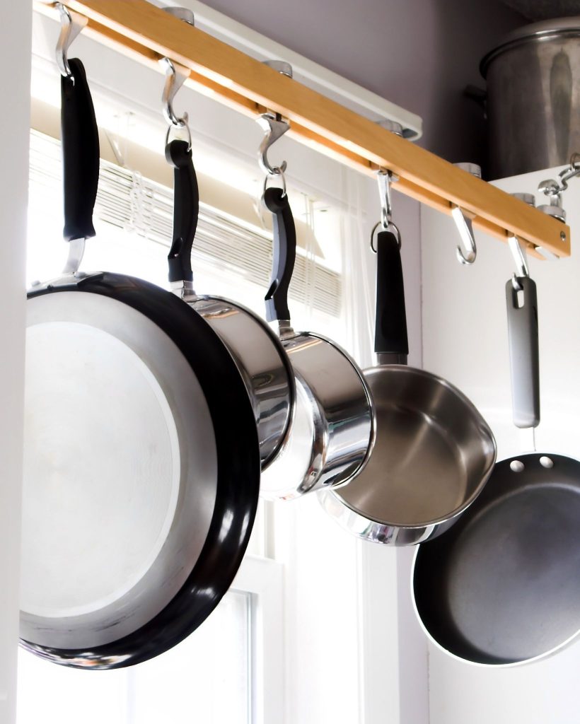 pots and pans hanging up in a kitchen