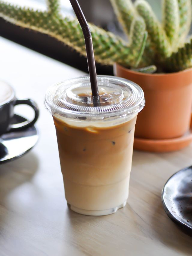iced coffee in a cup with a lid and straw