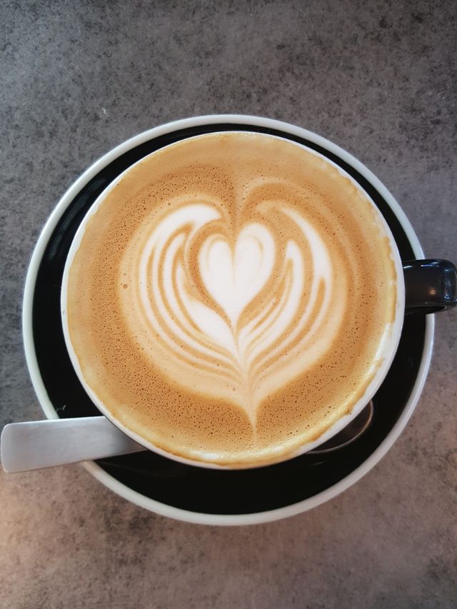 cappuccino with a heart shape in the middle of it