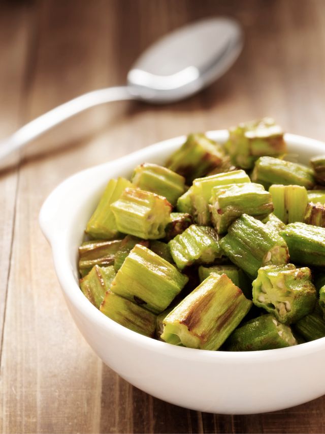 cooked okra in a bowl with a spoon