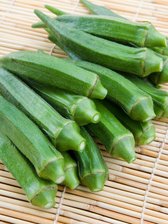 green okra on a straw platter