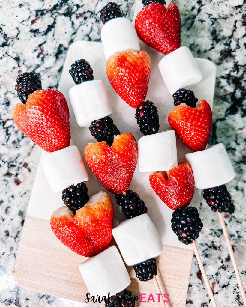 4th of july fruit skewers made of raspberries blackberries and marshmallows