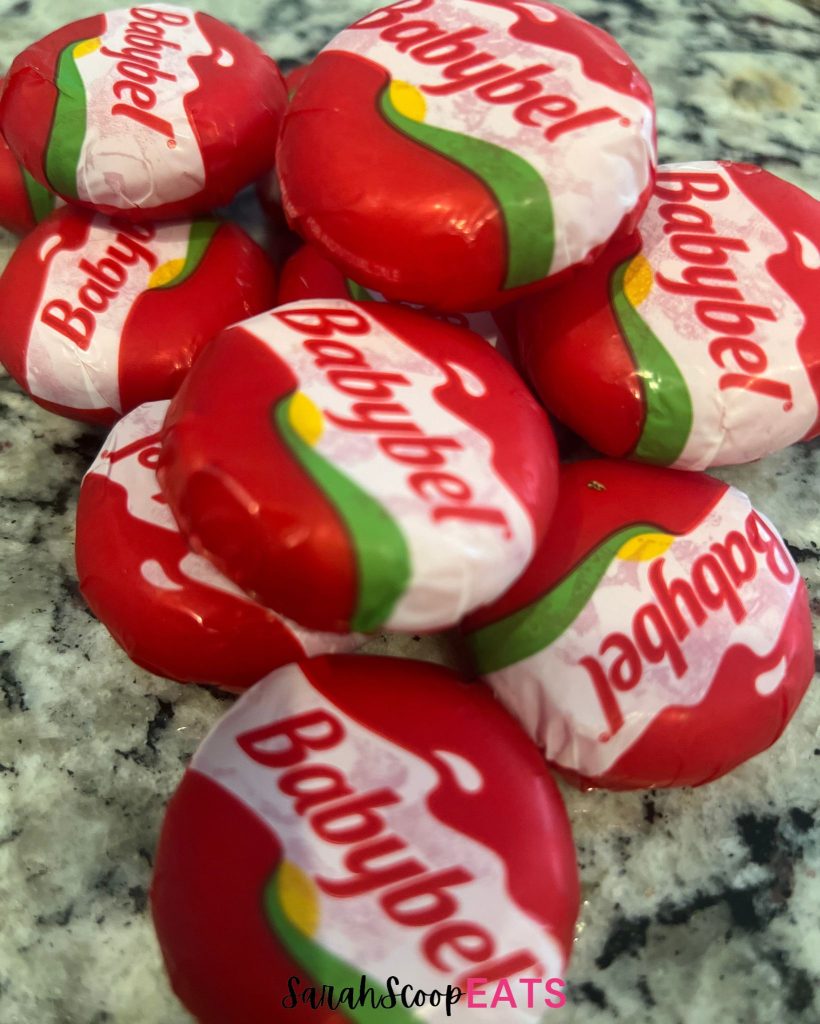 babybel cheeses on counter top