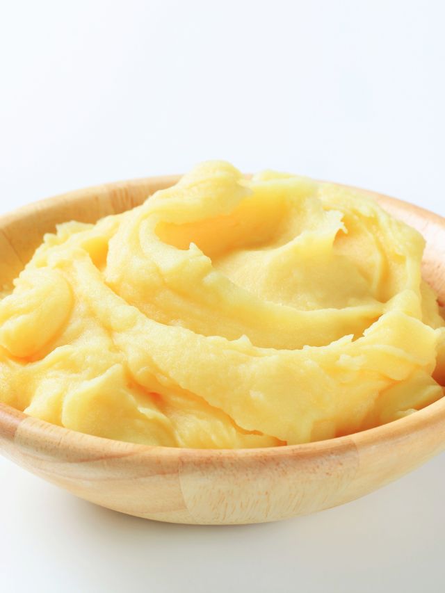 serving bowl filled with mashed potatoes