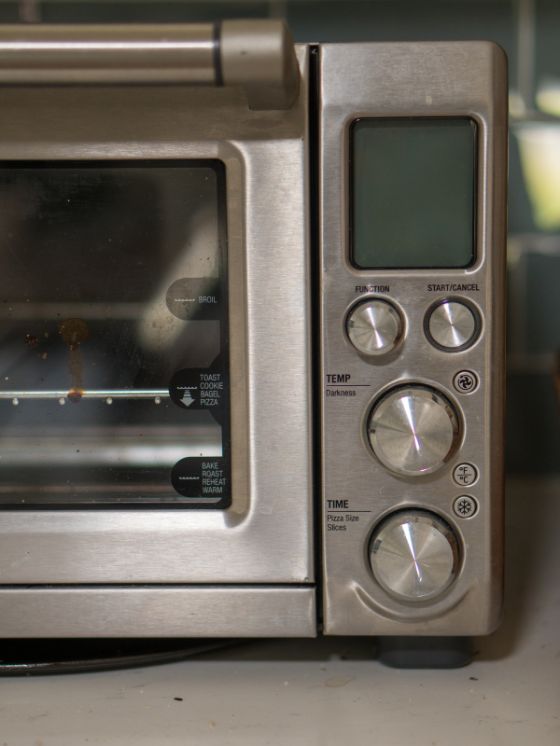 close up of buttons on a toaster oven