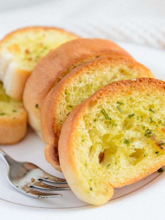 plate filled with texas toast and a fork
