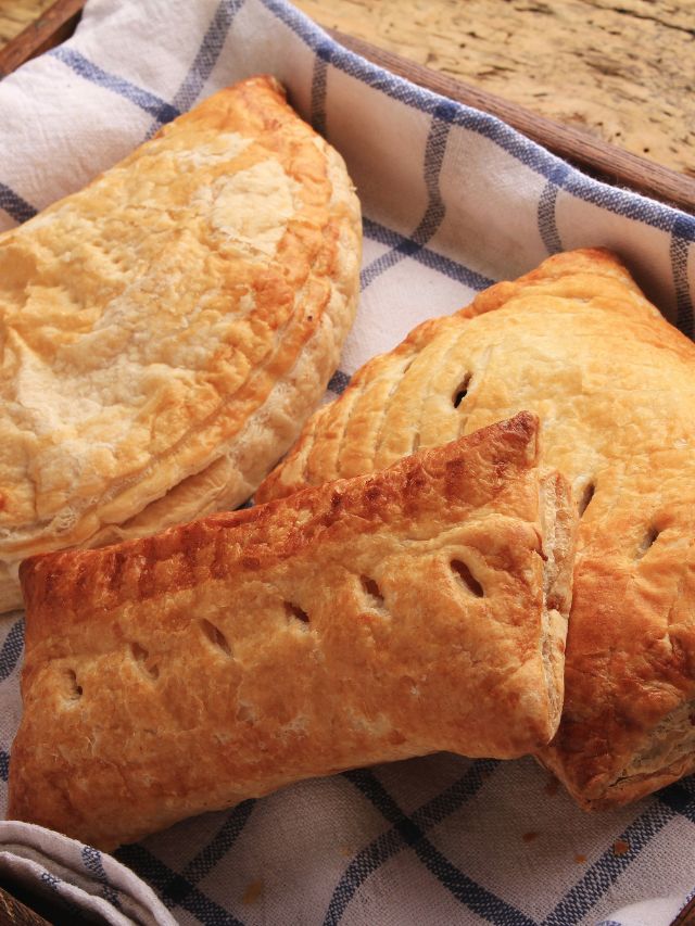 baked pasties on dish towel