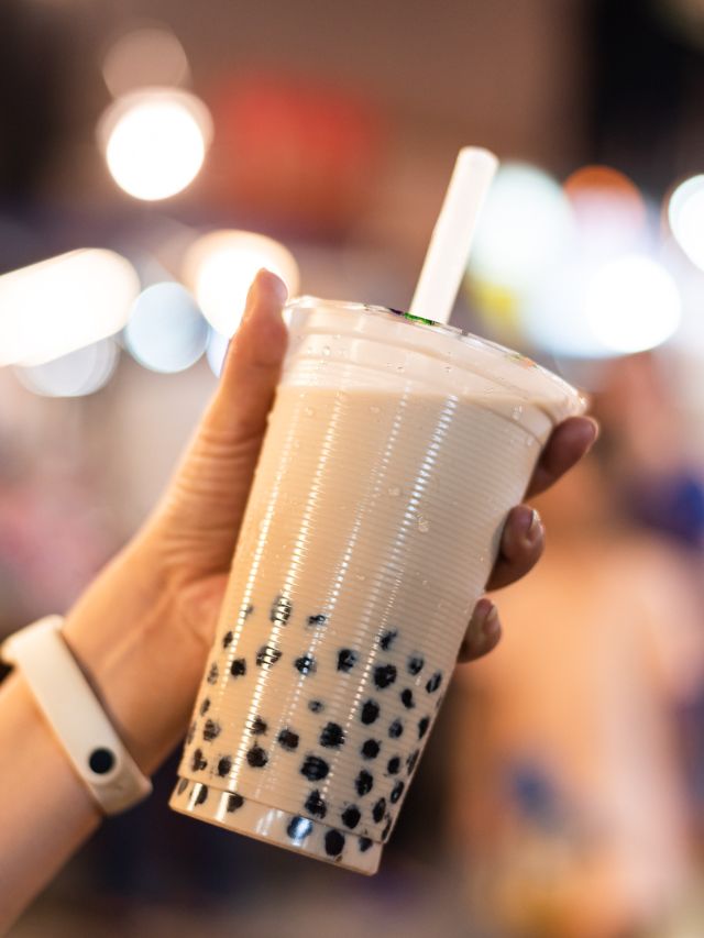 hand holding a cup of bubble tea
