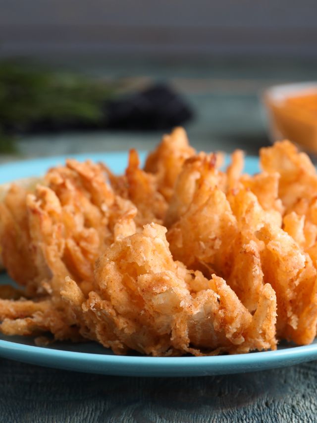 blooming onion on a blue plate
