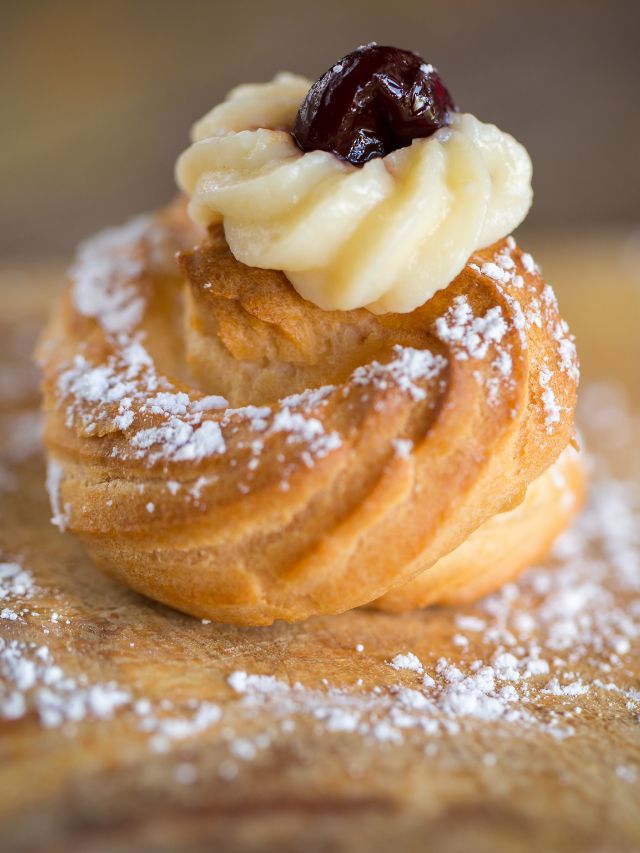 close up of zeppoles with powdered sugar