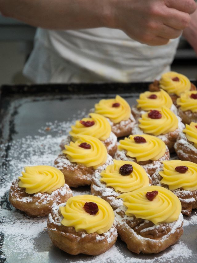 making zeppoles with frosting
