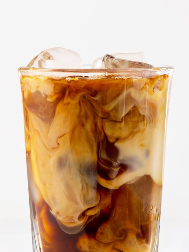 close up of iced latte in clear glass