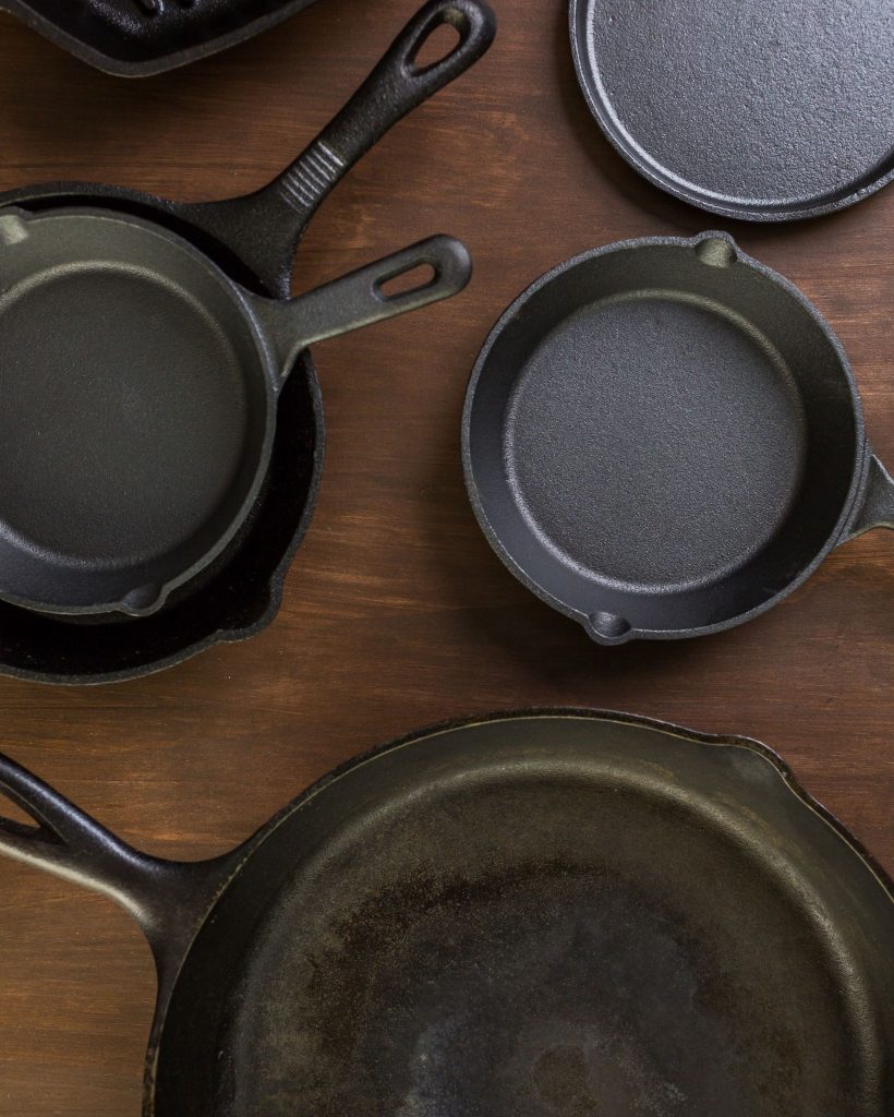 skillets on wooden table