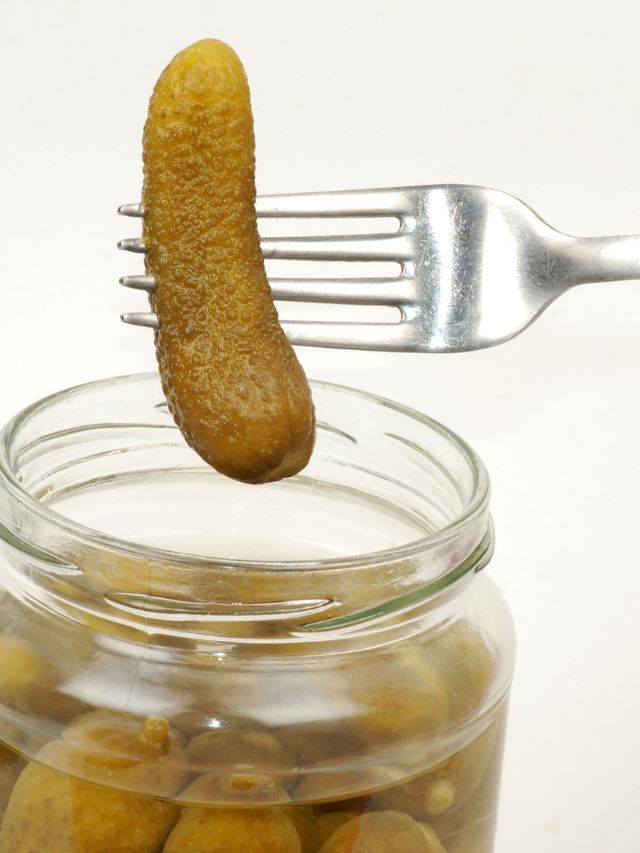 fork and pickle above a pickle jar