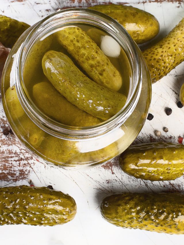pickles in a jar and around the jar
