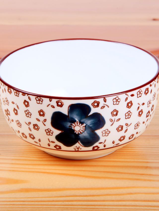 ceramic painted bowl on wood table