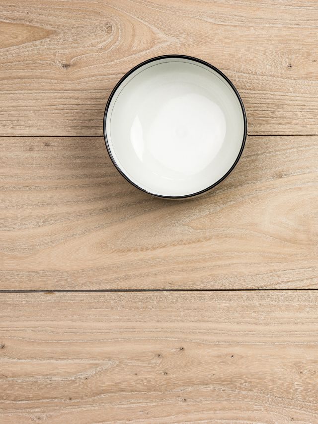 white ceramic bowl on wooden table