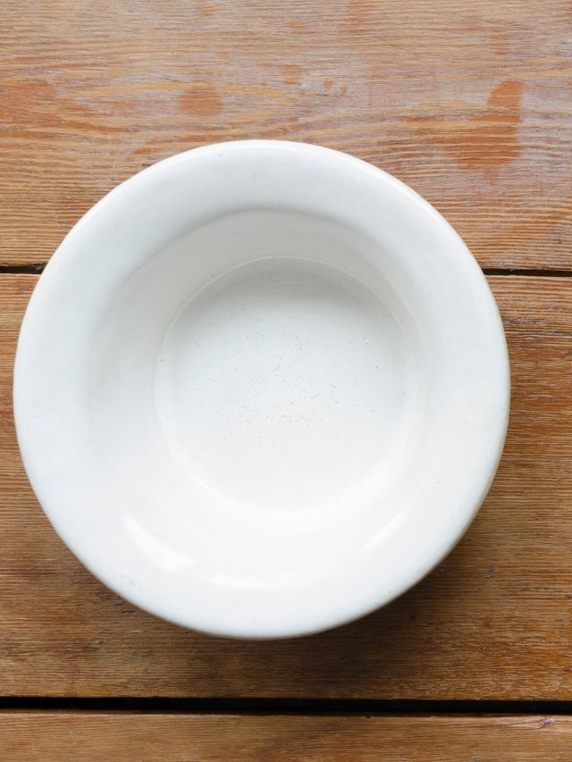 white bowl on wooden table
