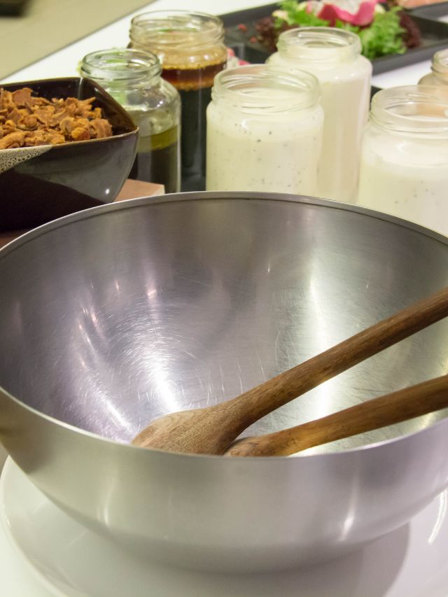 wooden spoon in stainless steel bowl