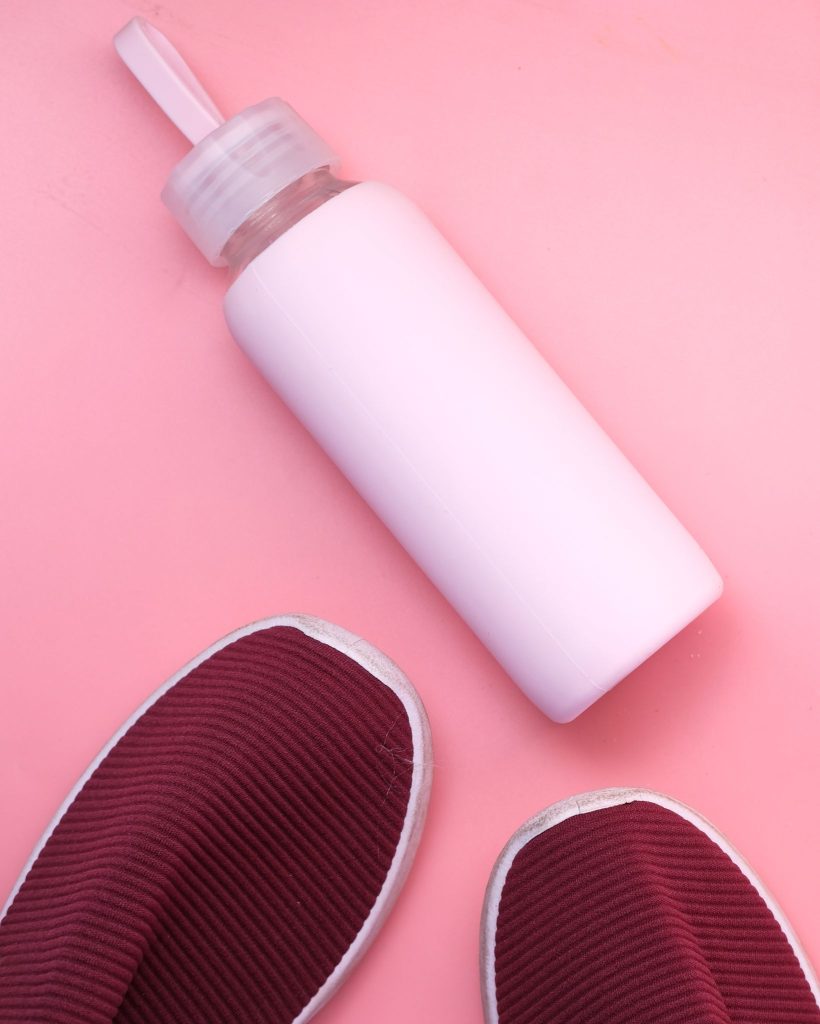 pink water bottle on pink background