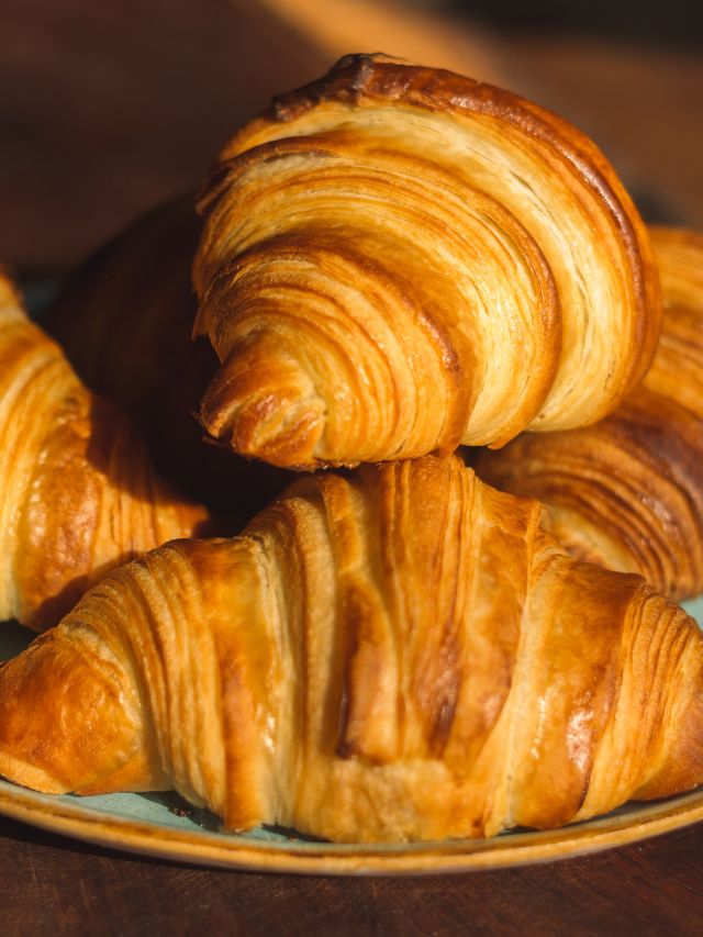 close up of croissants on plate