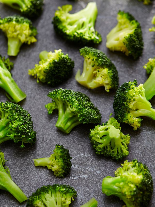 broccoli laid out in black background