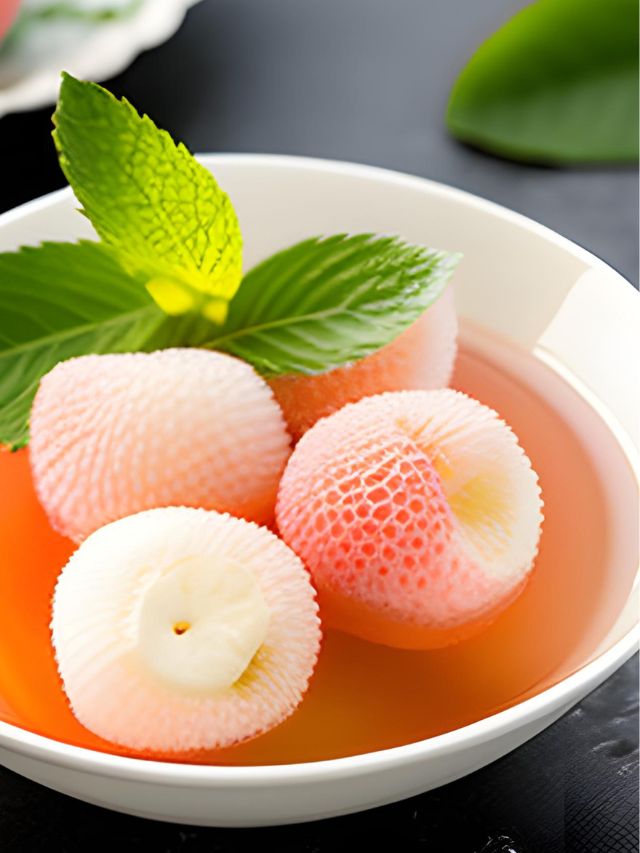 lychee jelly balls in bowl with garnish