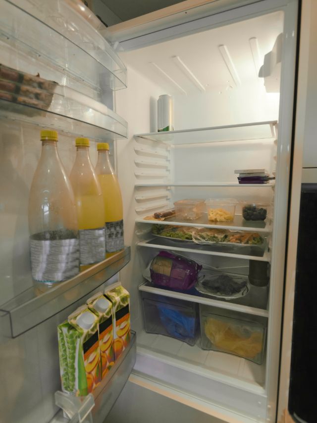 open fridge with food inside it