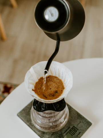 A coffee dripper is being used to make coffee.