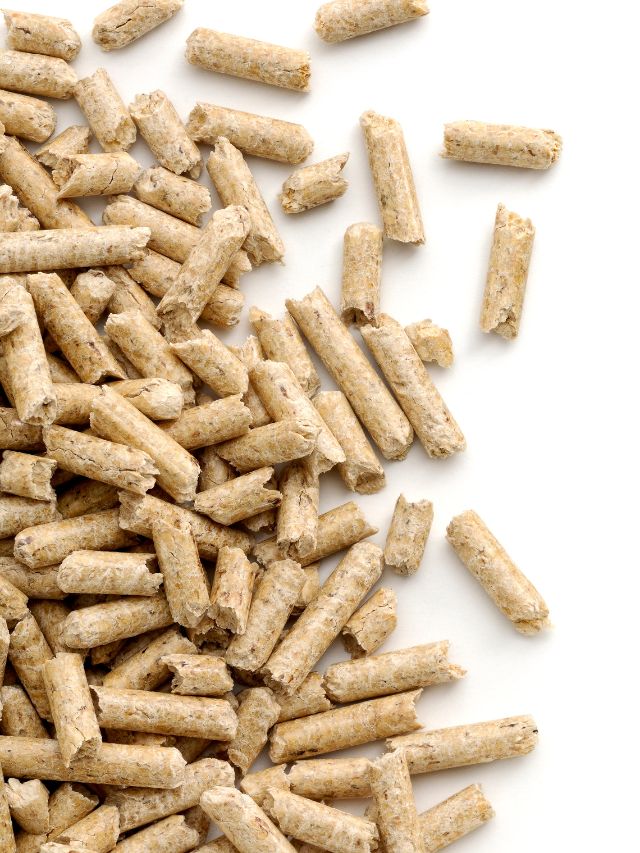 A pile of wood pellets on a white background.