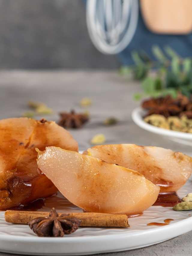 Pear slices with cinnamon and spices on a plate.
