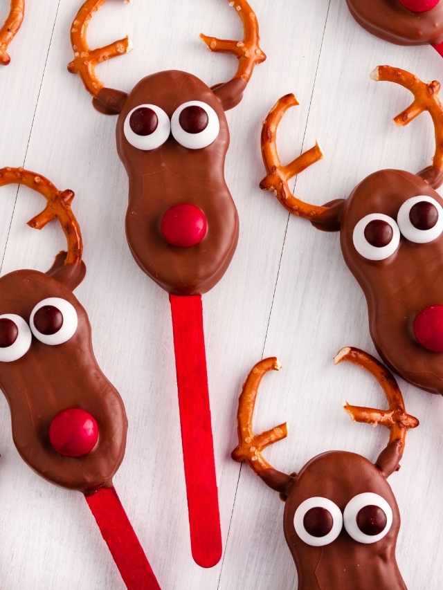 Chocolate reindeer lollipops with pretzel sticks.