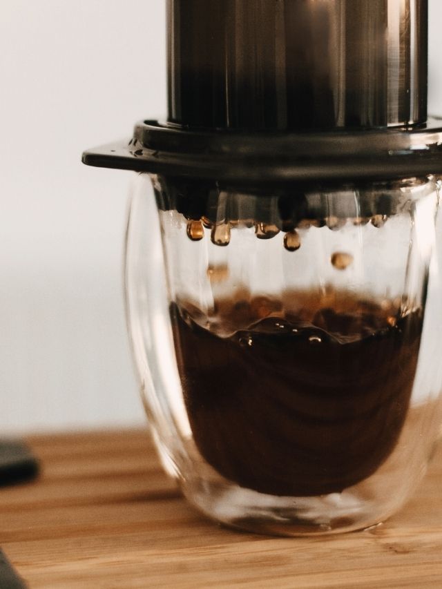 An easy AeroPress espresso recipe is being followed using a coffee maker.