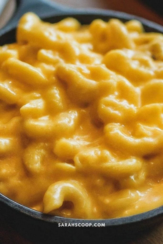 A skillet filled with creamy macaroni and cheese.